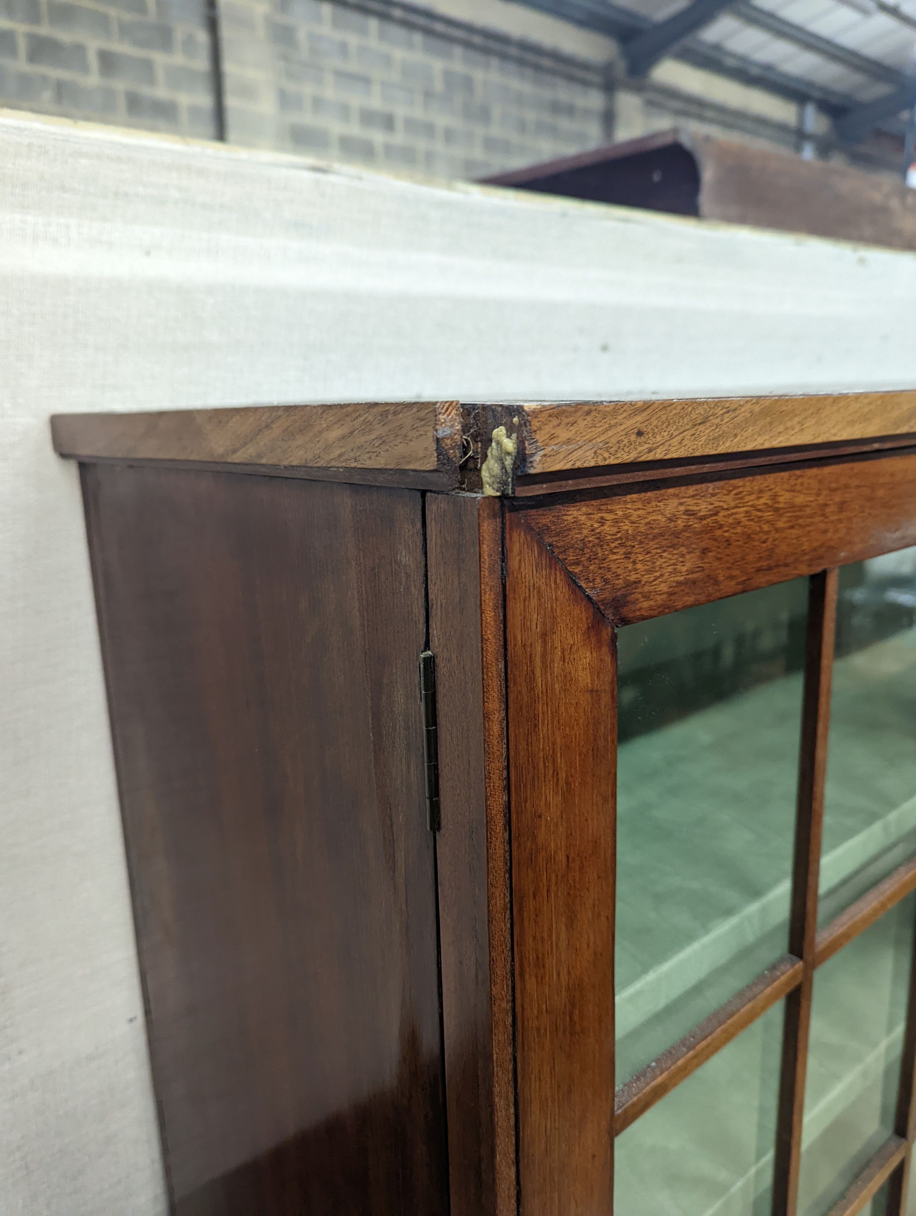 A 19th century Continental mahogany glazed side cabinet, width 116cm, depth 40cm, height 166cm